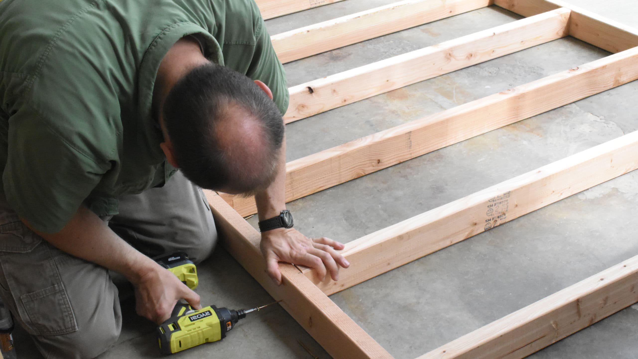 Alex building a frame with 2x4s