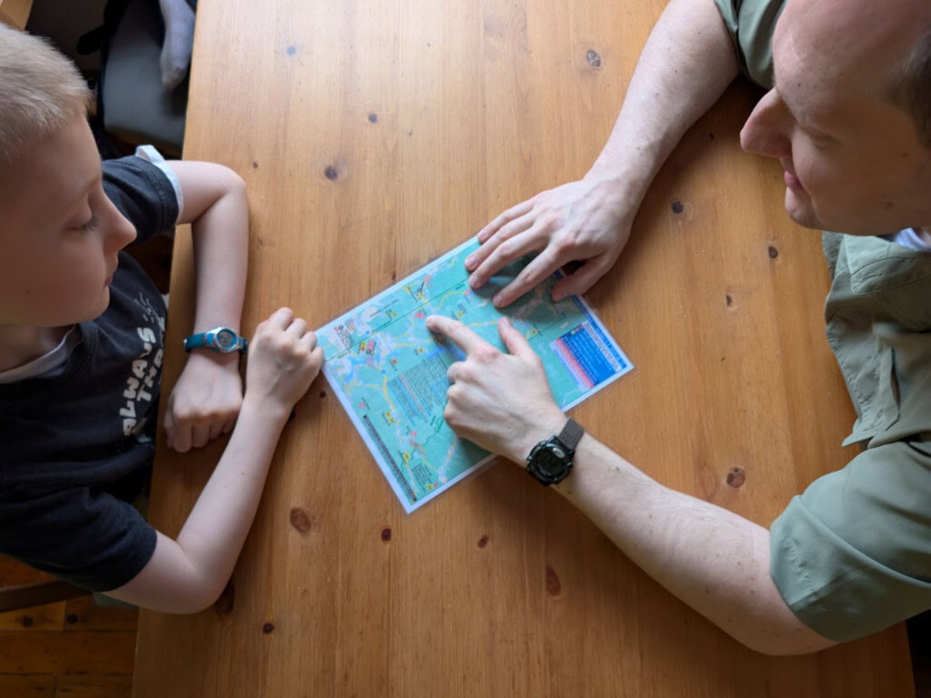 Father and son discussing locations for safe rally points