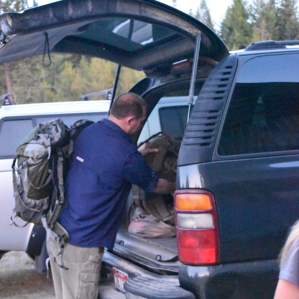 Man load back of vehicle during evacuation drill