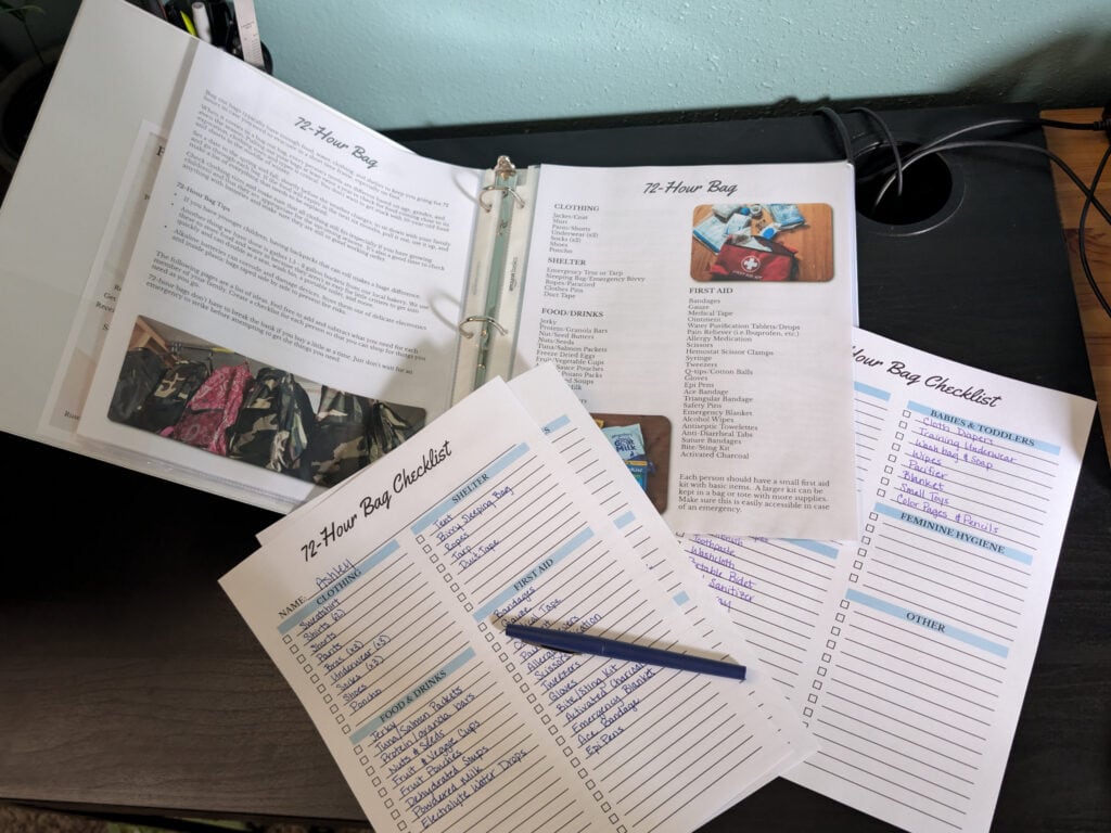 Preparedness binder with checklists on desk