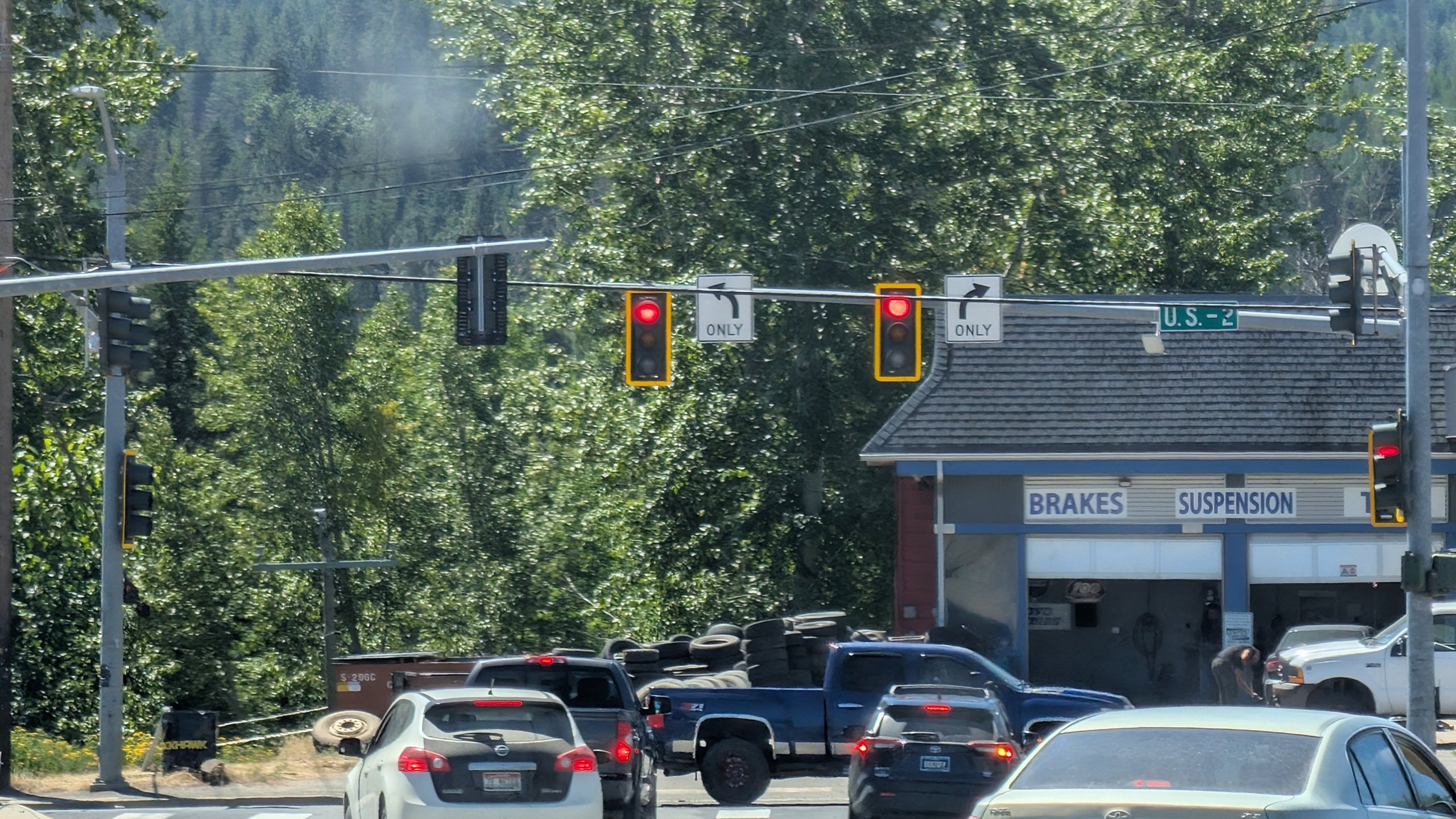 Vehicles sitting at a red light waiting for traffic