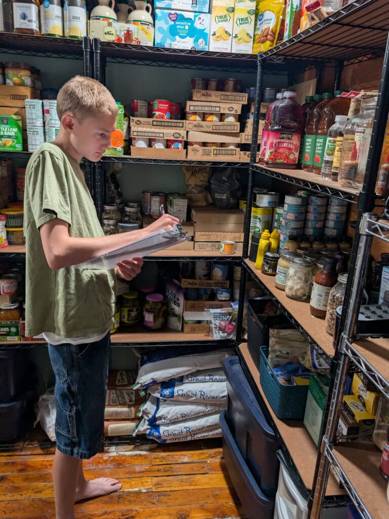 Young boy helping with deep food inventory