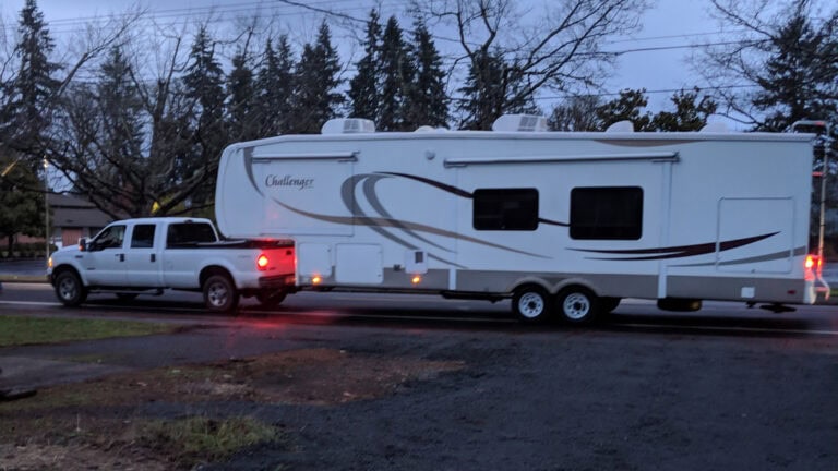 RV & Truck traveling down the road